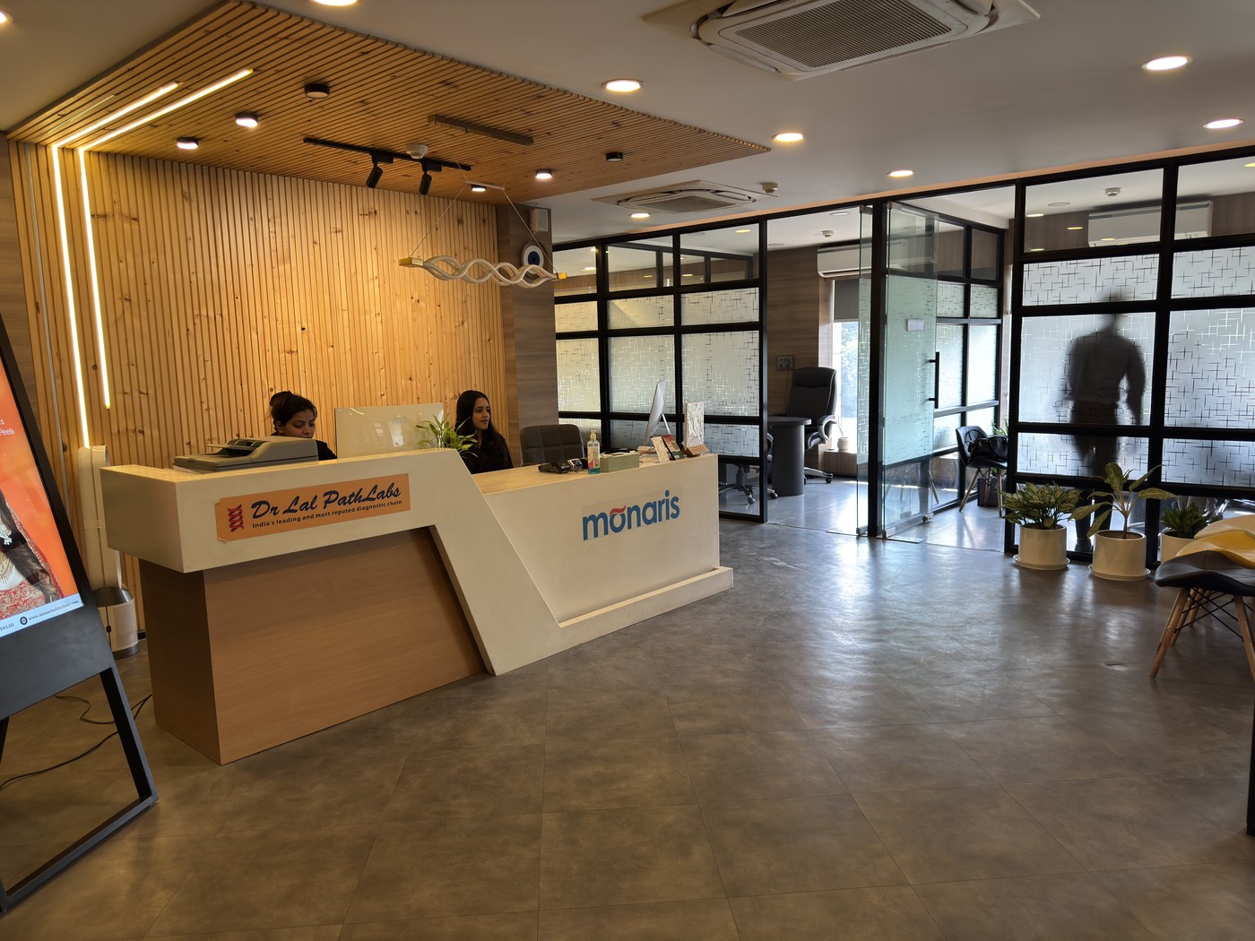 Monaris Skin & Hair Clinic reception — 1st Floor, E 13, Ring Rd, above Fortis Cancer Institute, Block E, Defence Colony, New Delhi 110024